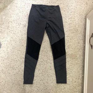 Like new S/M Onzie leggings in charcoal with black mesh on legs